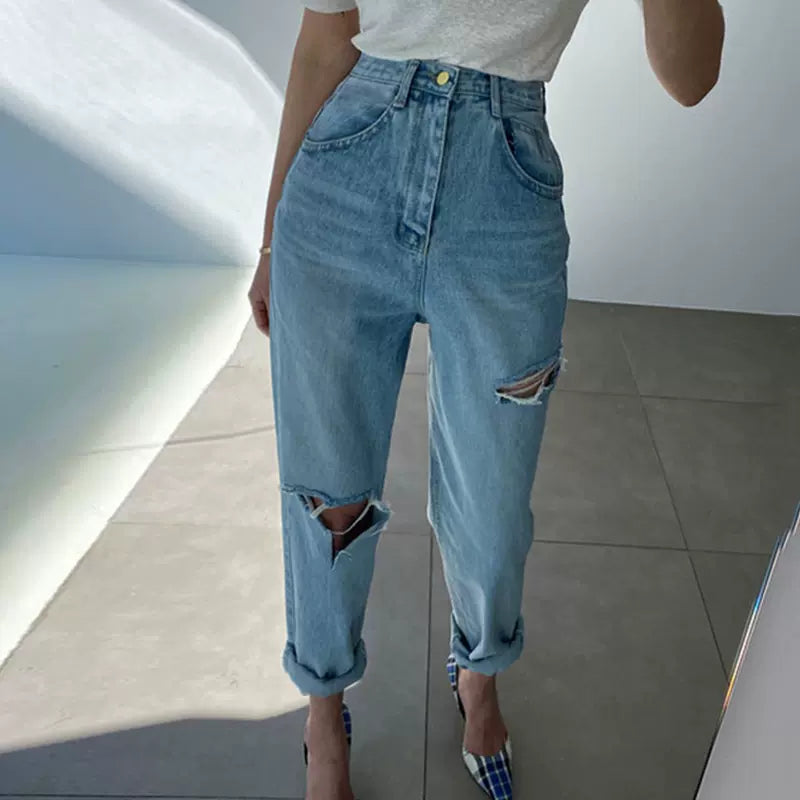 High-waisted ripped rolled-leg washed jeans